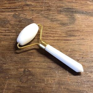White Facial Roller with Gold Hardware